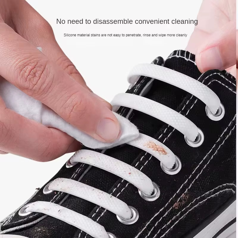Person cleaning white shoelaces on a black shoe with text about convenience and cleaning.